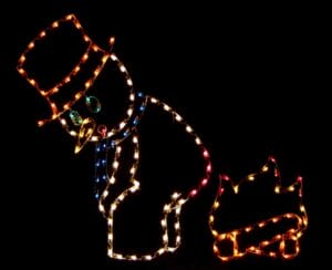 SNOWMAN STANDING BY FIRE